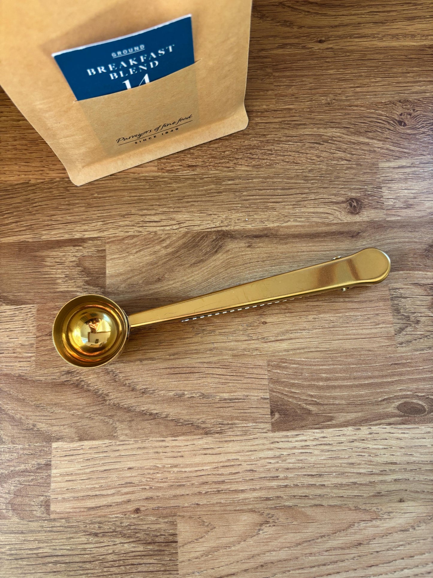Gold coffee scoop and bag clip