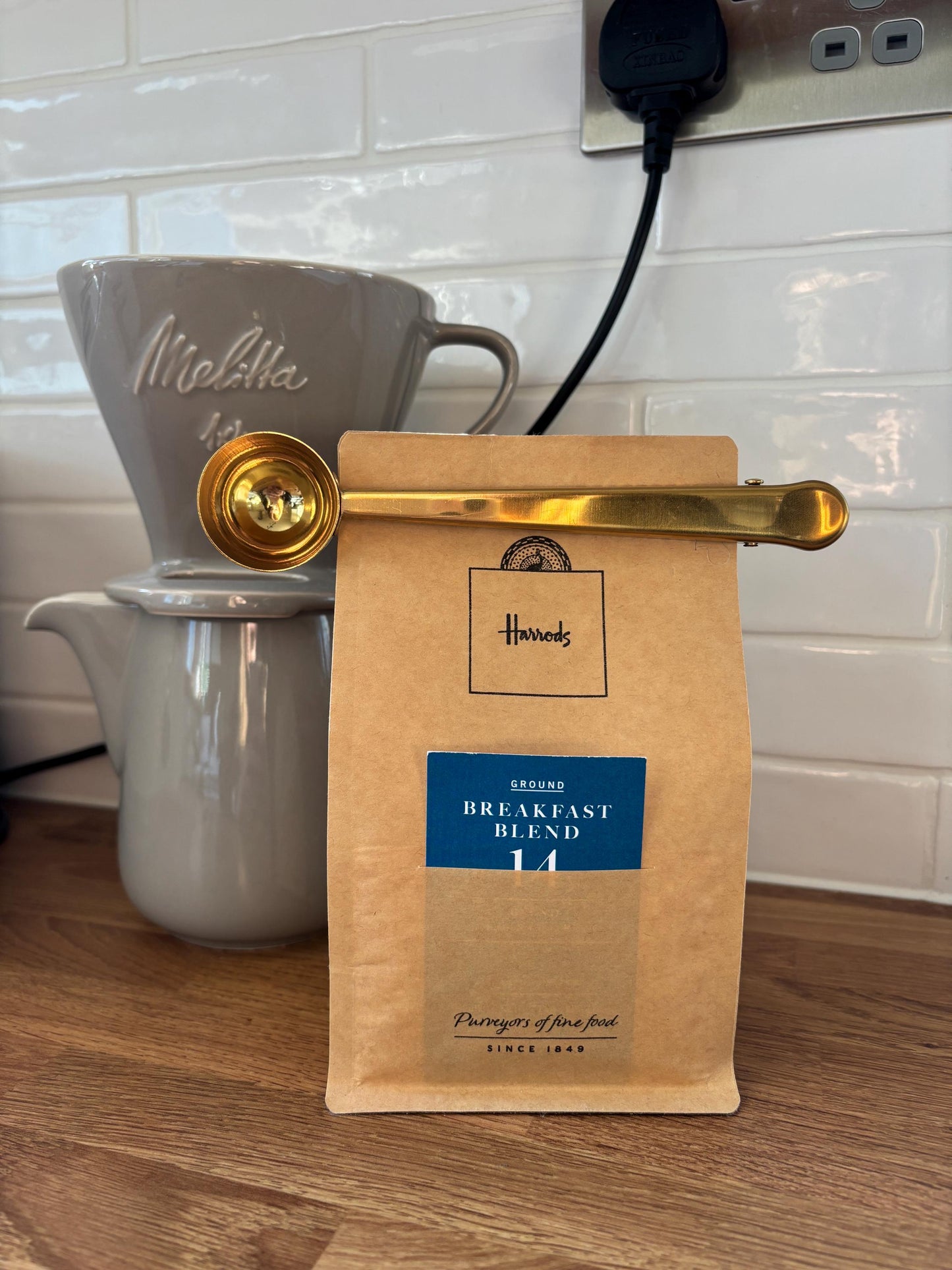 Gold coffee scoop and bag clip