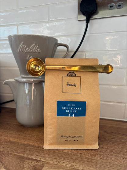 Gold coffee scoop and bag clip