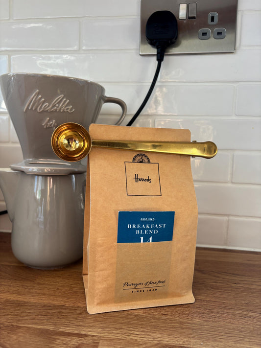 Gold coffee scoop and bag clip